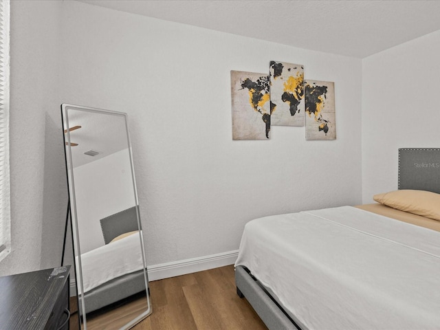 bedroom featuring hardwood / wood-style flooring