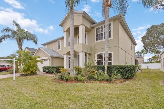 view of front of home featuring a garage and a front yard