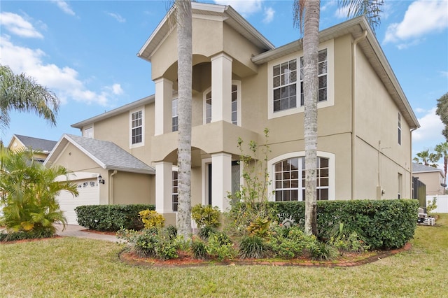 view of front of home with a garage and a front yard