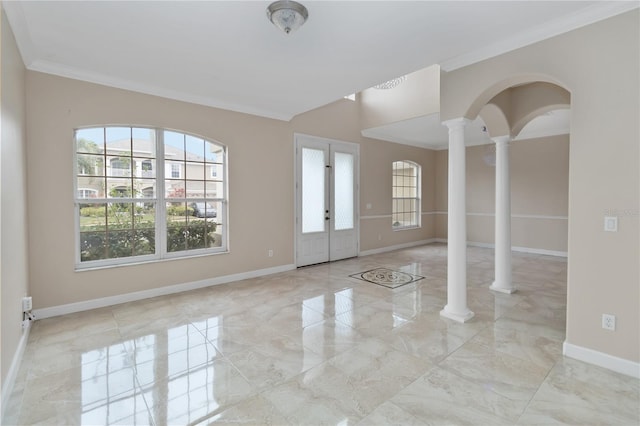 entrance foyer with crown molding and decorative columns