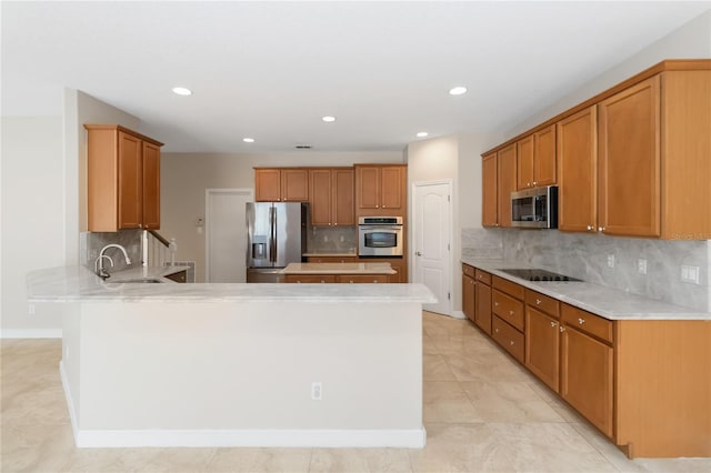 kitchen with tasteful backsplash, stainless steel appliances, kitchen peninsula, and sink