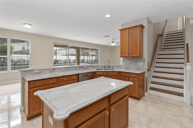 kitchen with a kitchen island, dishwasher, sink, backsplash, and kitchen peninsula