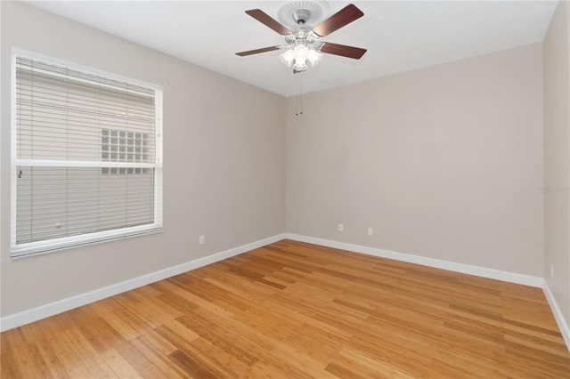 unfurnished room featuring hardwood / wood-style floors and ceiling fan