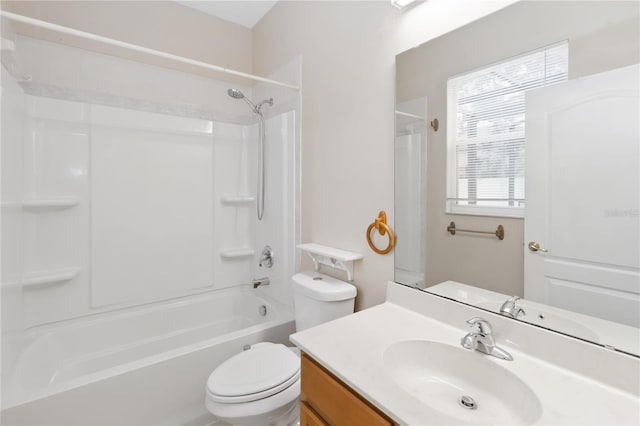 full bathroom featuring vanity, bathtub / shower combination, and toilet