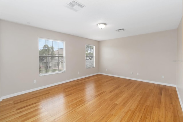 unfurnished room featuring light hardwood / wood-style flooring