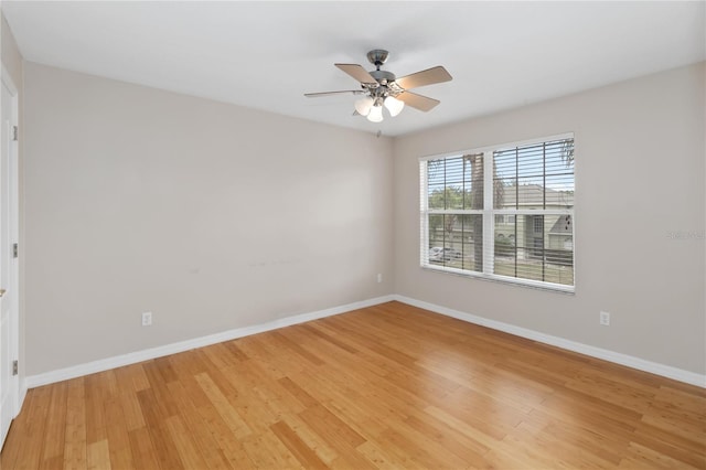 unfurnished room with ceiling fan and light wood-type flooring