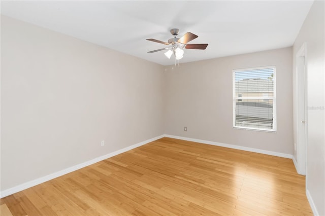 empty room with ceiling fan and light wood-type flooring