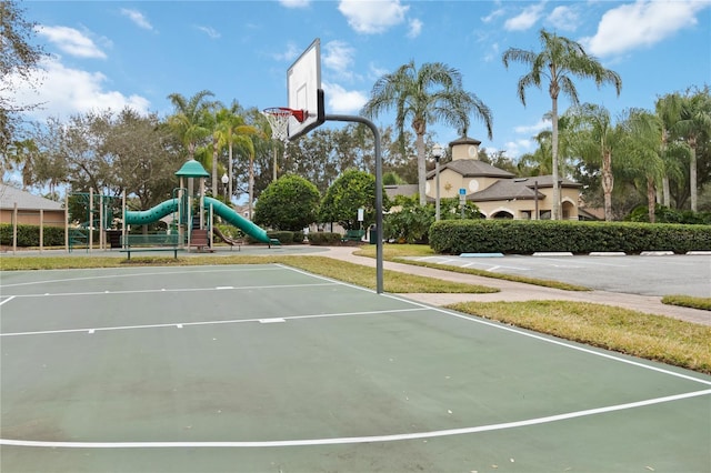 view of sport court with a playground