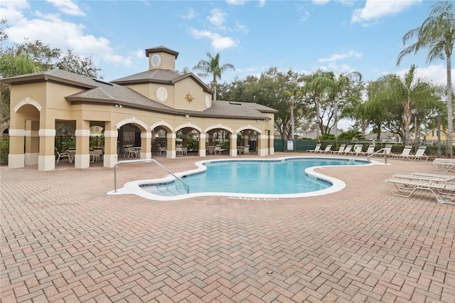 view of swimming pool featuring a patio