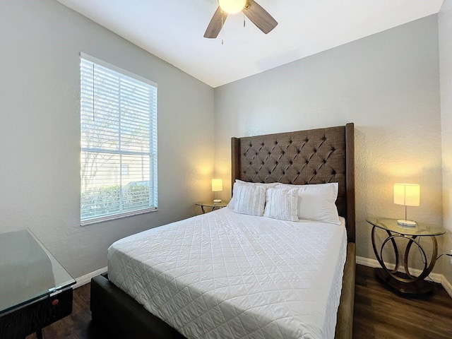 bedroom featuring ceiling fan and dark hardwood / wood-style floors