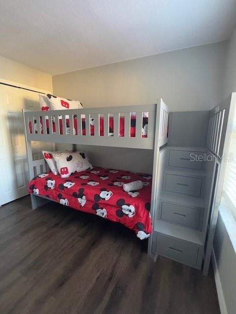 bedroom featuring dark hardwood / wood-style flooring