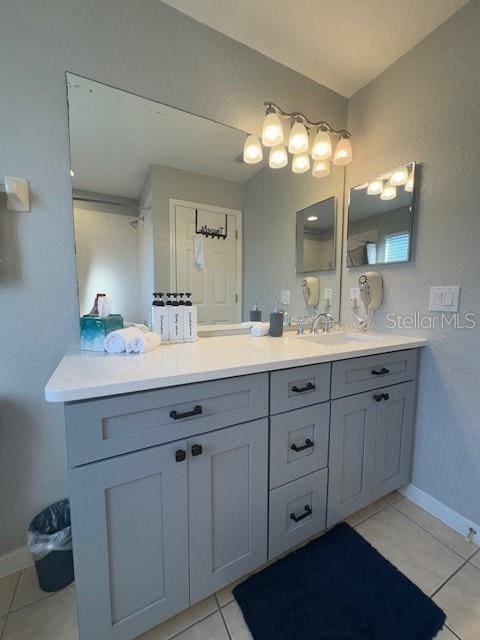 bathroom with vanity and tile patterned floors