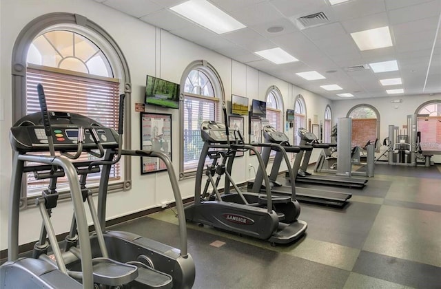 exercise room featuring a paneled ceiling