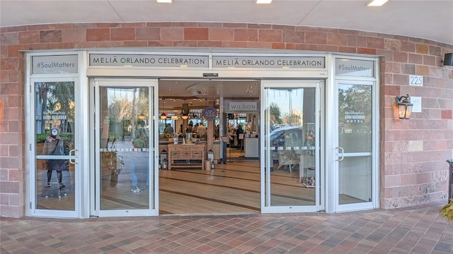 property entrance with brick siding