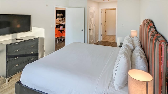 bedroom featuring a closet and wood finished floors