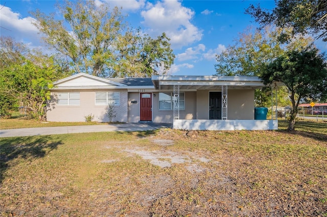1707 Gammon Ln, Orlando, FL 32811 - ranch-style house with a front lawn and brick siding