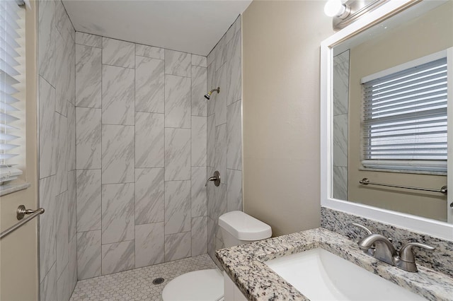 full bath with toilet, a shower stall, and vanity