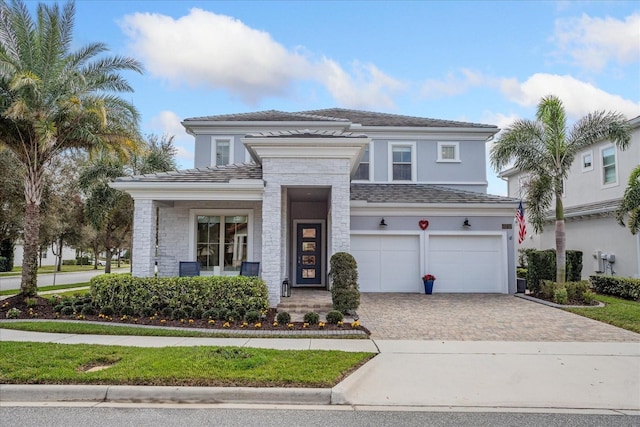 view of front of property featuring a garage and covered porch