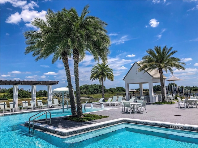 view of swimming pool featuring a gazebo and a patio area