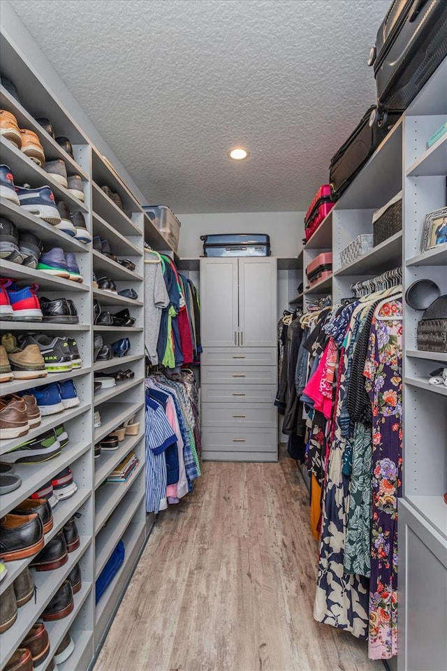 walk in closet featuring light wood-type flooring