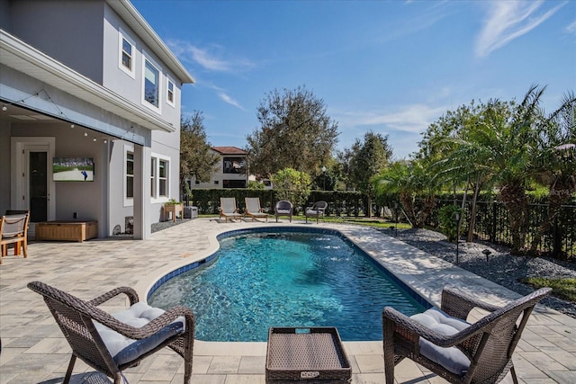 view of pool featuring a patio