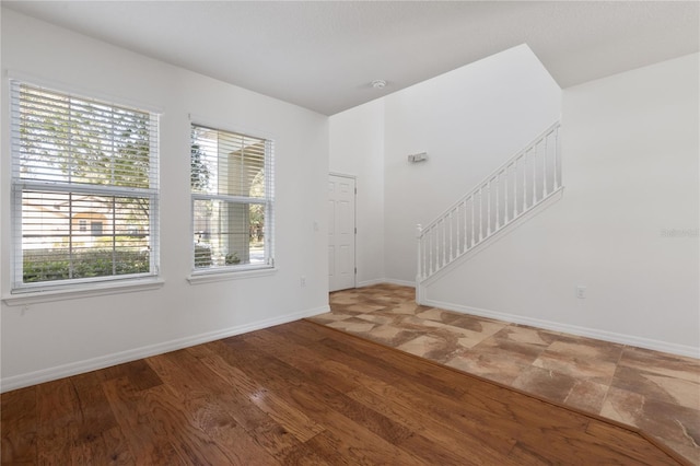 empty room with wood-type flooring