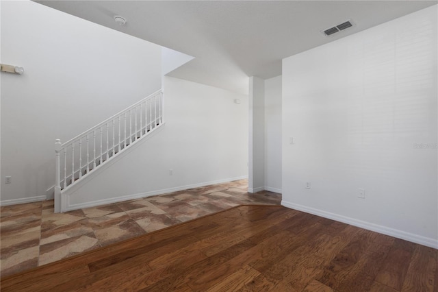 unfurnished living room featuring hardwood / wood-style flooring