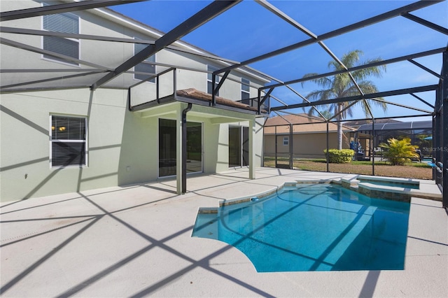 view of pool featuring an in ground hot tub, a lanai, and a patio area