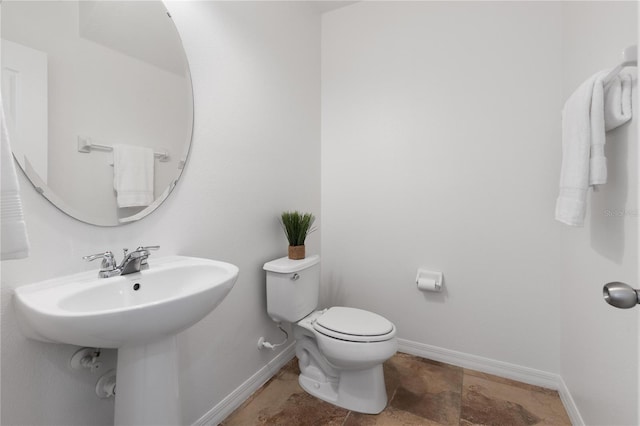 bathroom with sink and toilet