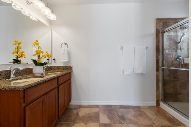 bathroom featuring vanity and a shower with shower door