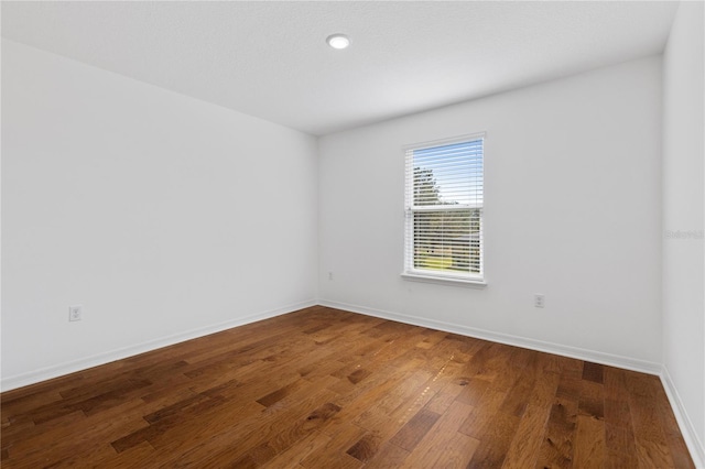 empty room featuring hardwood / wood-style floors