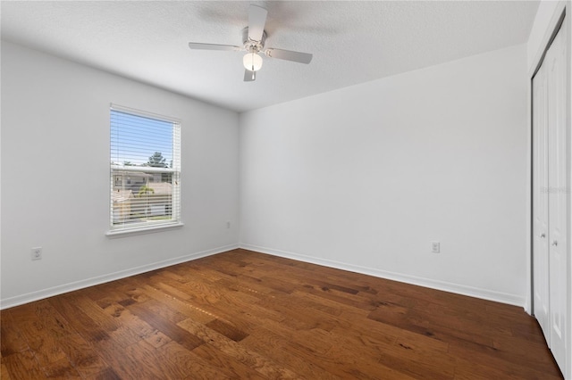 unfurnished room with hardwood / wood-style flooring, a textured ceiling, and ceiling fan