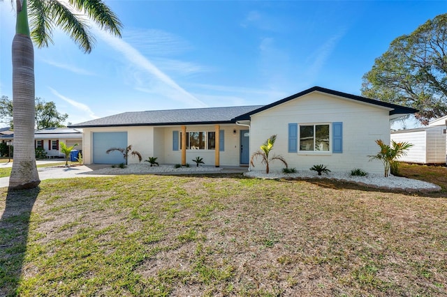 single story home with a garage and a front yard