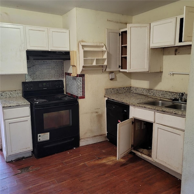 kitchen with sink, white cabinetry, light stone counters, dark hardwood / wood-style floors, and black appliances