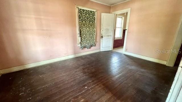 unfurnished room featuring dark wood-type flooring