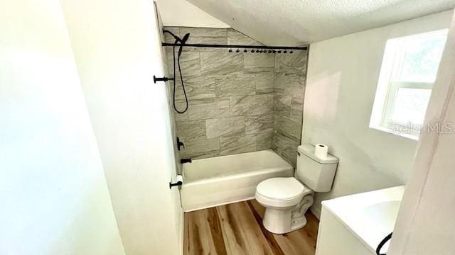 214 N New Hampshire Ave, Tavares, FL 32778 - full bath with vanity, wood finished floors, toilet, bathing tub / shower combination, and a textured ceiling