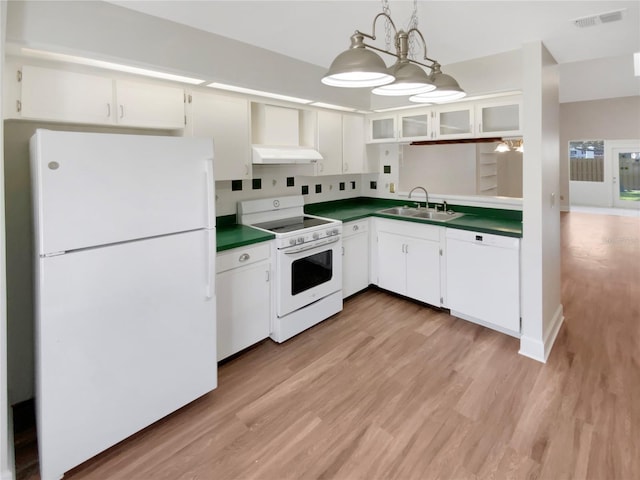 kitchen featuring sink, white cabinetry, pendant lighting, white appliances, and light hardwood / wood-style floors