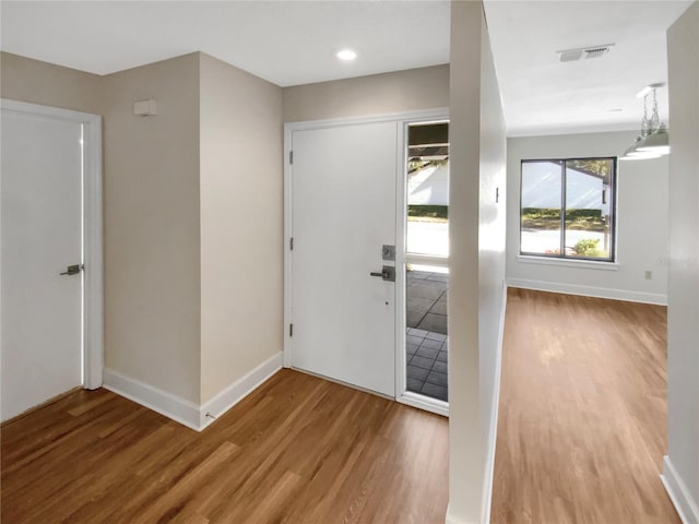 foyer entrance with light hardwood / wood-style floors