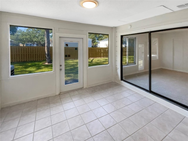 doorway to outside featuring light tile patterned floors