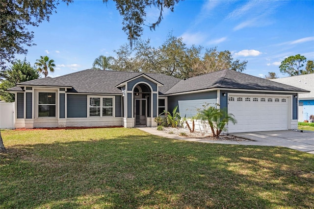 ranch-style home featuring a garage and a front yard