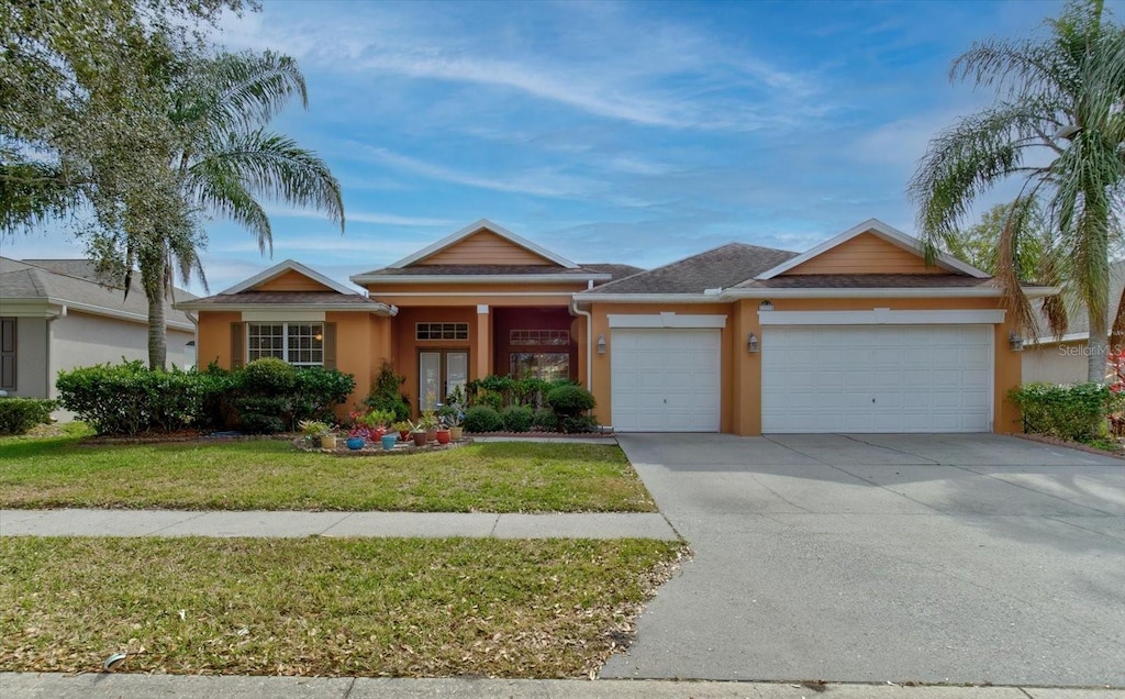 view of front of house featuring a garage and a front yard