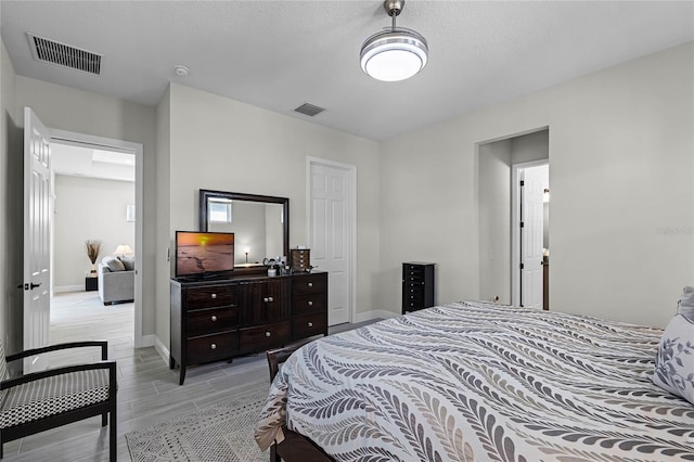 8456 Norwich Way, Mount Dora, FL 32757 - bedroom featuring wood tiled floors and baseboards