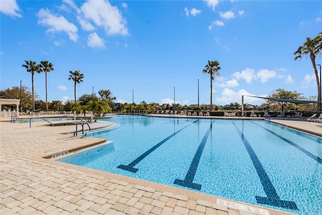 8456 Norwich Way, Mount Dora, FL 32757 - community pool with a patio area