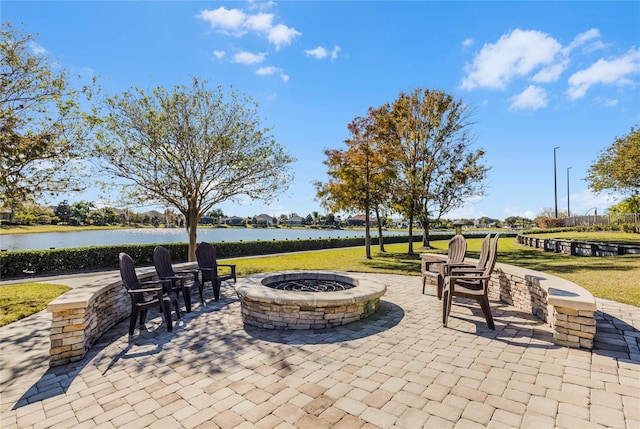 8456 Norwich Way, Mount Dora, FL 32757 - view of patio featuring a fire pit and a water view