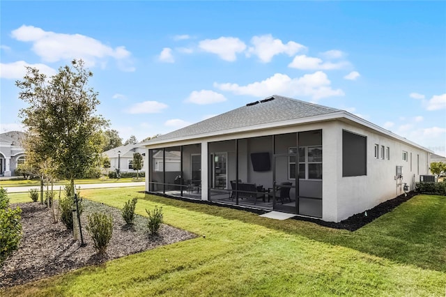 8456 Norwich Way, Mount Dora, FL 32757 - rear view of property featuring a sunroom, a yard, stucco siding, and a shingled roof