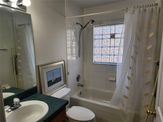 full bathroom with vanity, toilet, and shower / tub combo