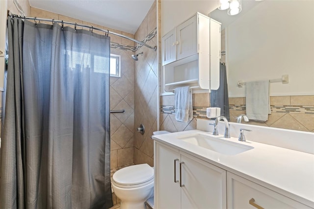 bathroom featuring tile walls, vanity, a shower with curtain, and toilet