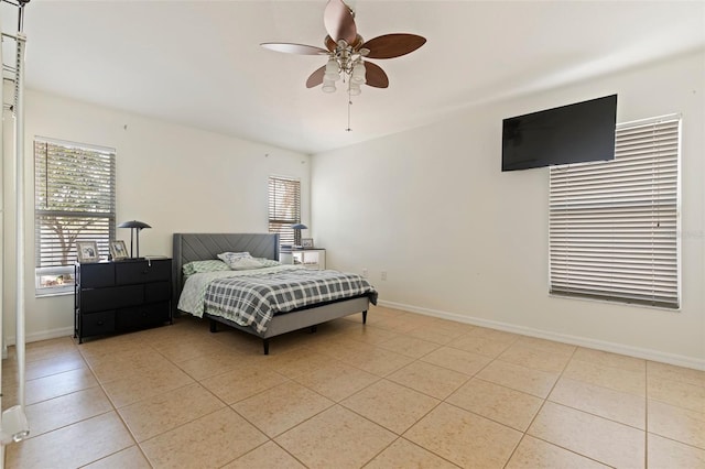 bedroom featuring light tile patterned floors and ceiling fan