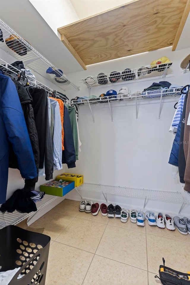 spacious closet featuring tile patterned flooring