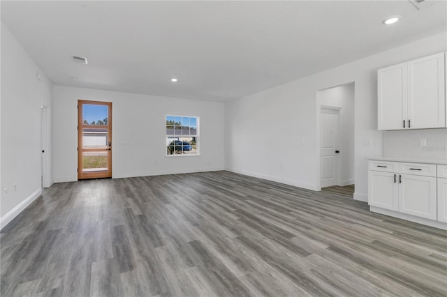 unfurnished living room with light hardwood / wood-style flooring